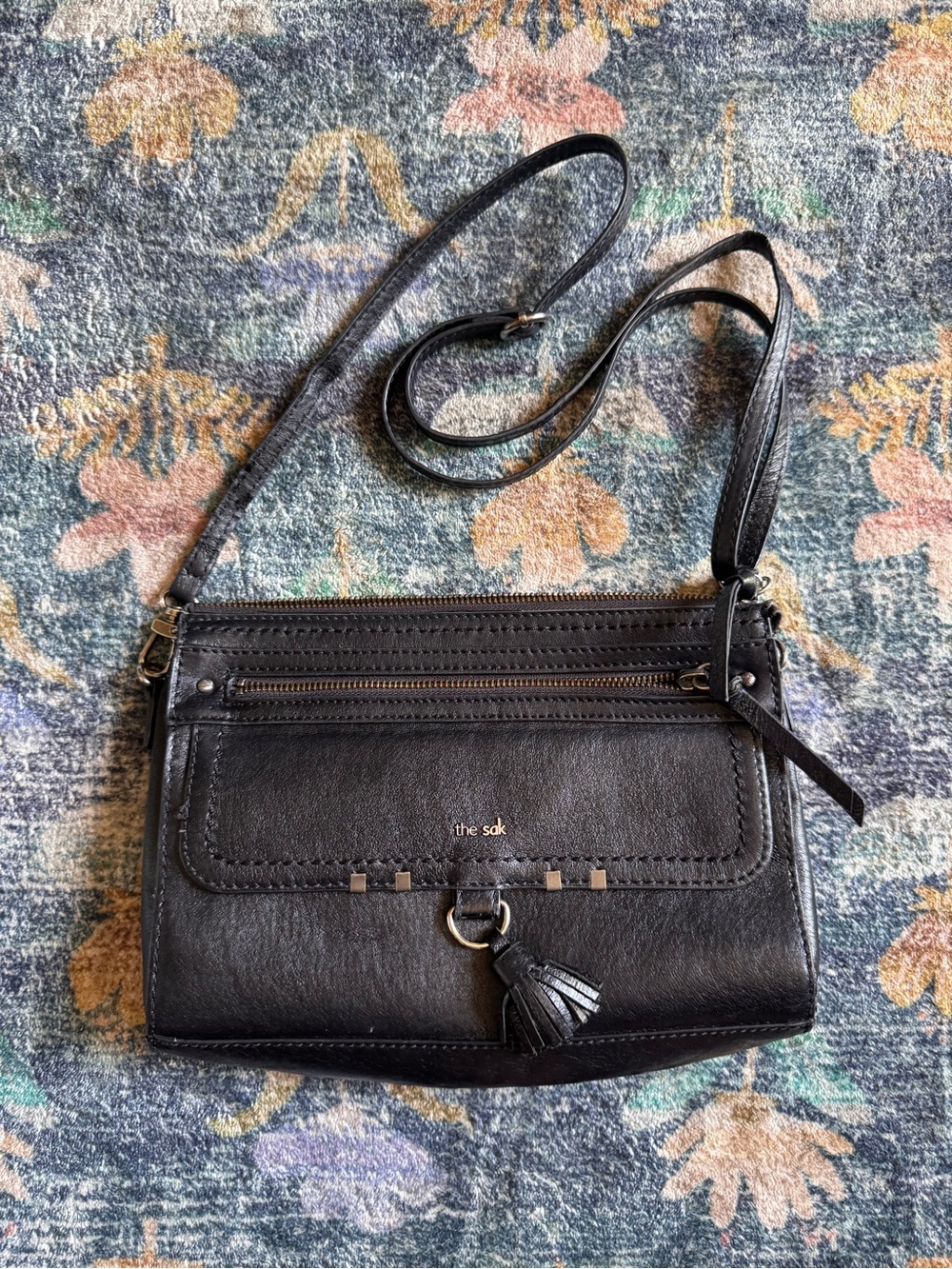 The Sak Black Leather Crossbody with Tassel Accent